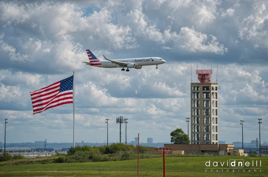 American Airlines landing at DFW with flag